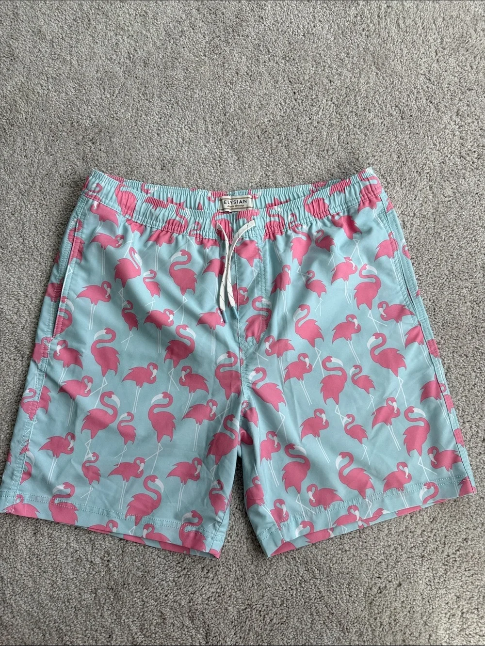 Elysian brand Men’s swim trunks in a blue and pink flamingo print- Size Medium